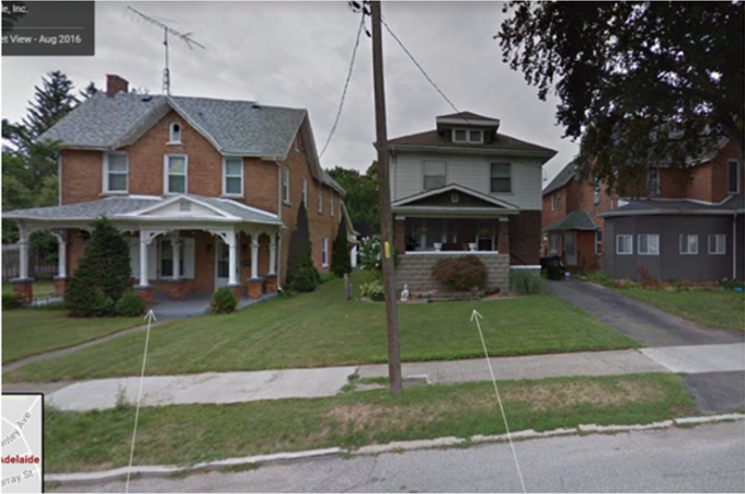The Google map image captures the front of the two houses between which the initial struggle between the Complainant and police took place.