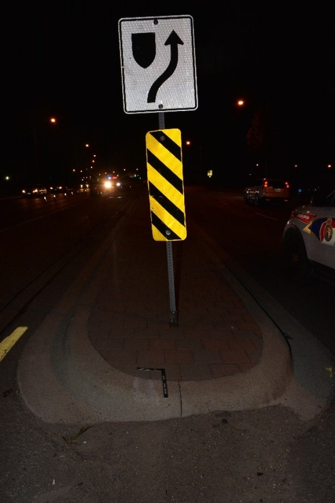 The street sign struck by the motorcycle