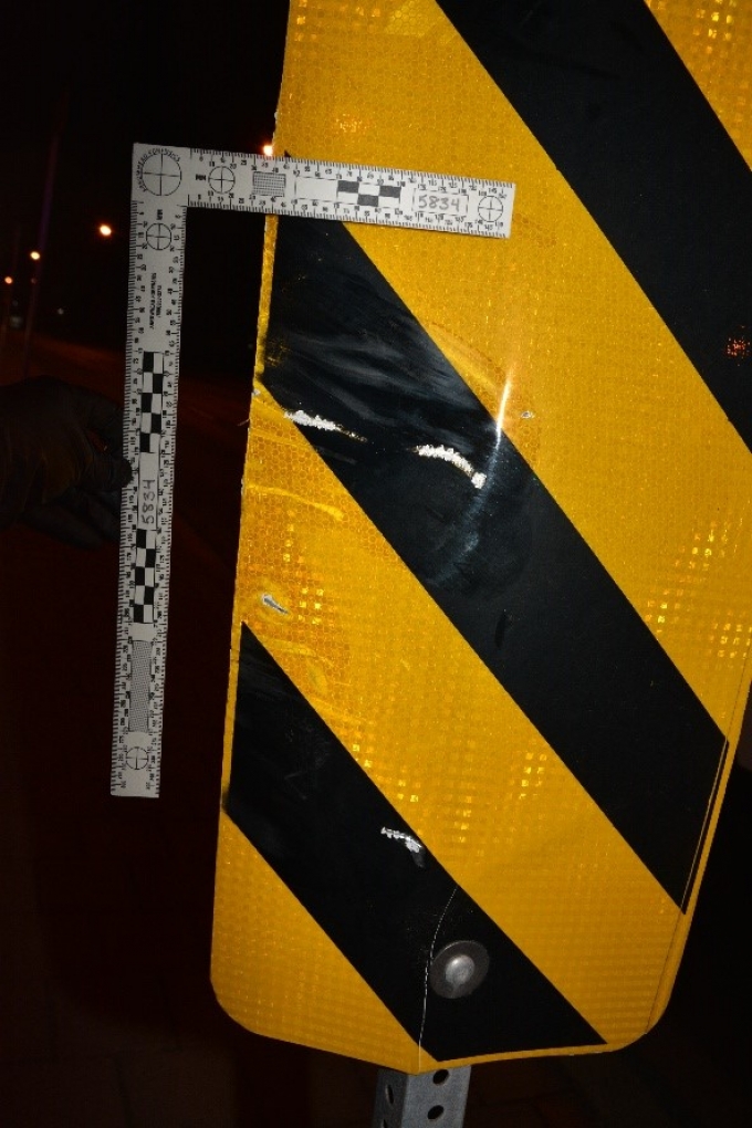 The street sign struck by the motorcycle: