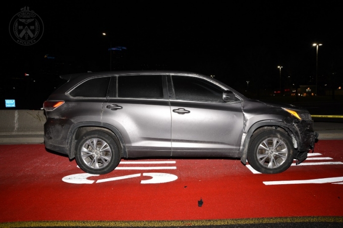 At the bottom of the ramp, where the concrete barrier ended, Vehicle 6 was located [TPS Surveillance Vehicle], a 2015 Toyota Highlander, brown in colour.  This vehicle was oriented west.  There was front end collision damage to this vehicle that could be attributed to this incident.