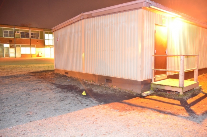 A 25 calibre semi-automatic pistol with five cartridges in the magazine and one in the breach was located near the east side wall of portable classroom number four