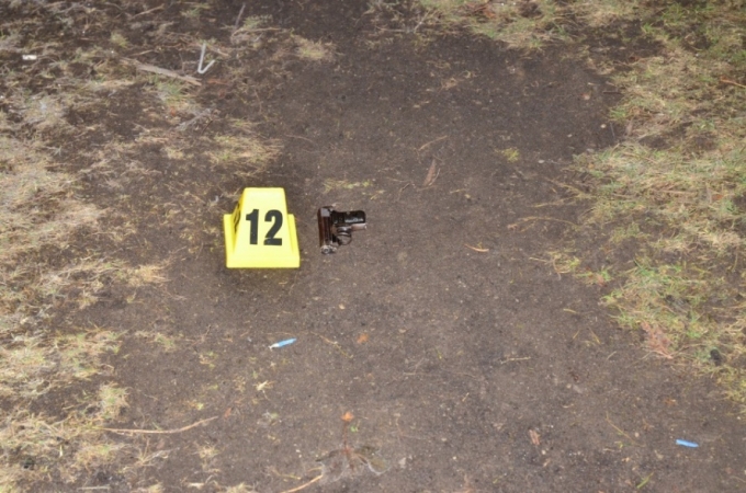 A 25 calibre semi-automatic pistol with five cartridges in the magazine and one in the breach was located near the east side wall of portable classroom number four