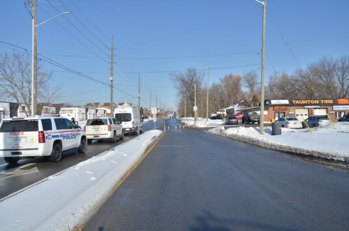 The camera angle is directed northbound on Townline Road, to where the collision occurred on the right side of the road, past the orange cones seen on the roadway.