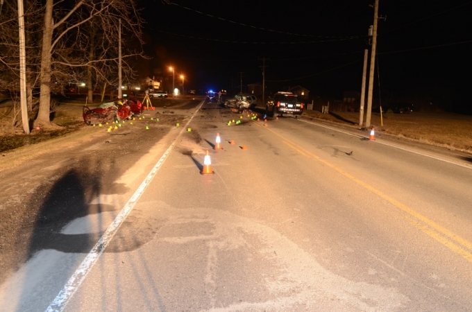 The red Sebring operated by Complainant #1 is seen to the left of the photo, post collision, while the SUV operated by Complainant #2 is seen in the centre of the roadway.