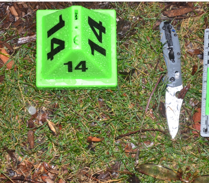 Open “Buck-knife” located under the tent and on the grass, east of the sidewalk