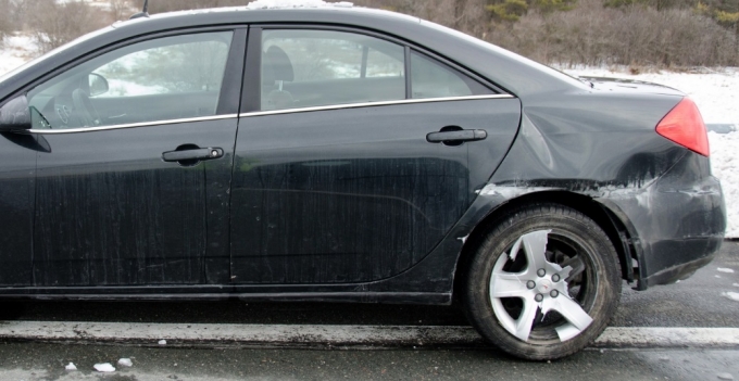Figure 4. View of the damage to the left rear of the Pontiac.