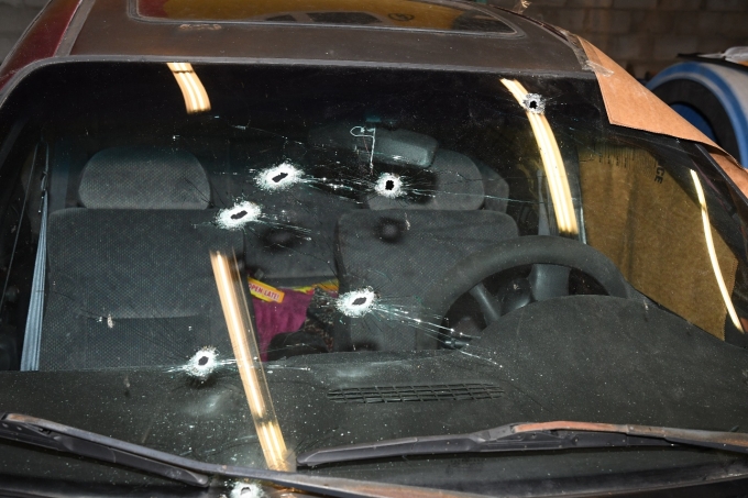 Figure 2 - The bullet holes in the windshield of the Complainant's Neon.