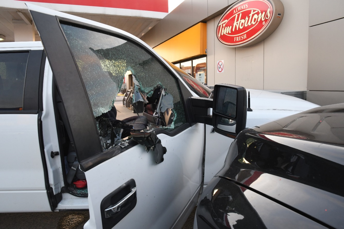 Figure 4 - The passenger-side window of the Ford F-150 appears smashed.