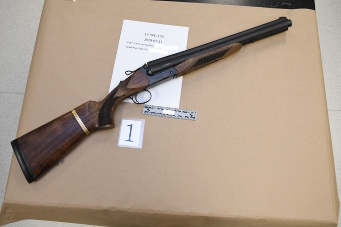 Figure 2 - The triple barrel shotgun found at the scene.