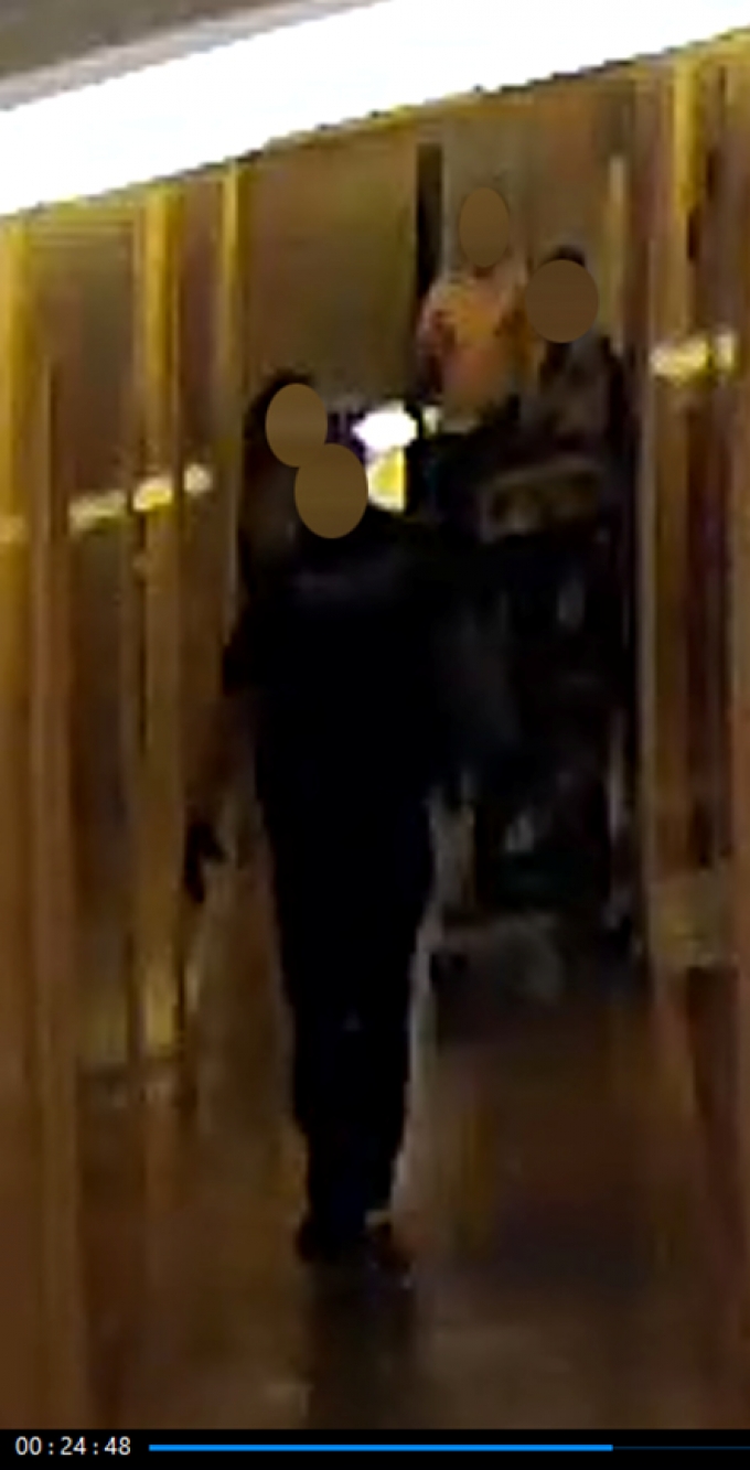Figure 8 - A still image from the security video recording depicting CW #7, followed by CW #2, entering the apartment.
