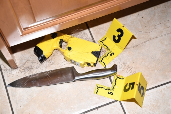 Figure 1 - The silver kitchen knife was located next to a CEW and CEW wires. 