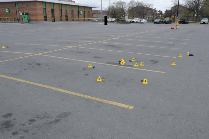 Figure 1 - The scene with yellow evidence markers placed by exhibits collected by the SIU, including ARWEN projectiles and cartridge cases.