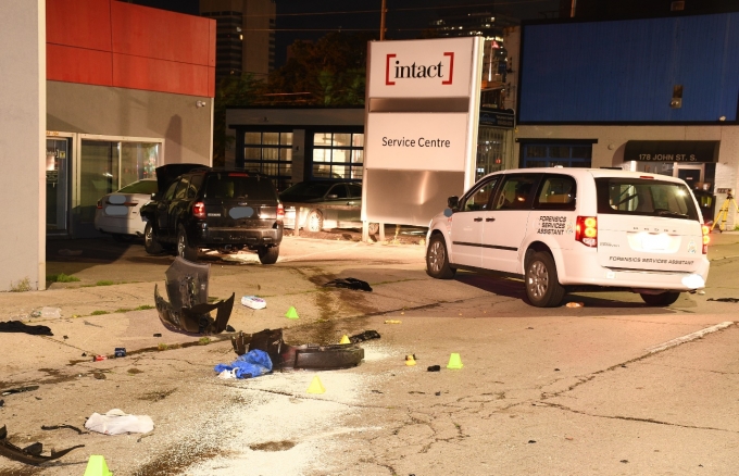 Figure 1 – Photograph of the Ford Escape, the SO’s vehicle and collision debris