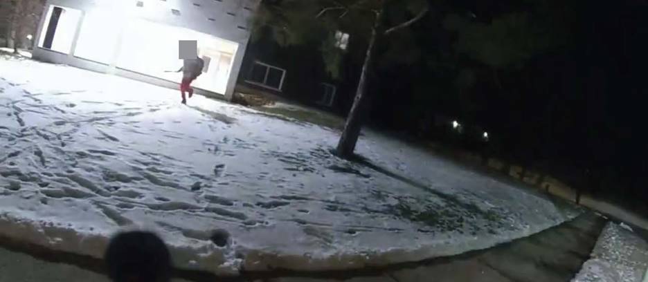 Figure 5 - Screenshot from the BWC footage, depicting the Complainant running toward the SO with a machete in his hand