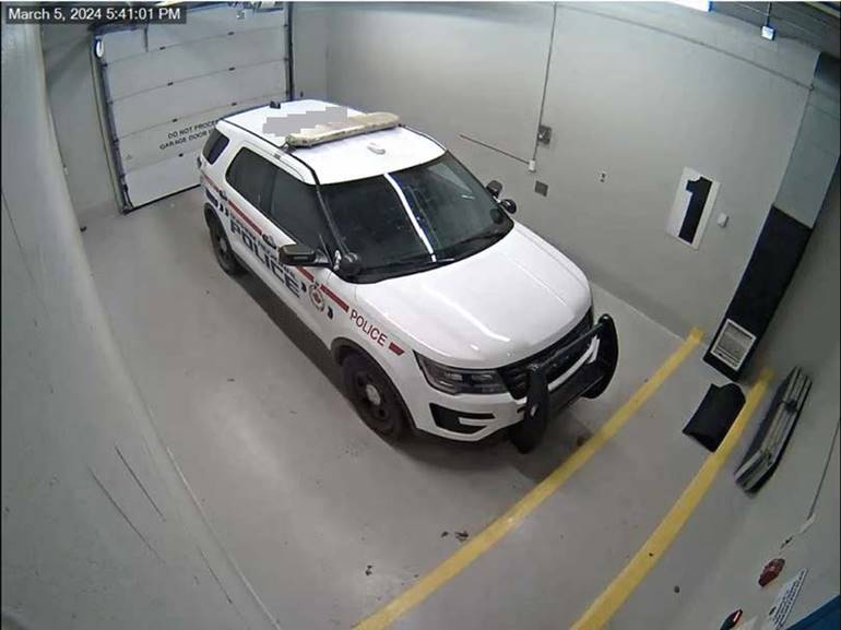 Figure 1 - Marked police vehicle inside sally port