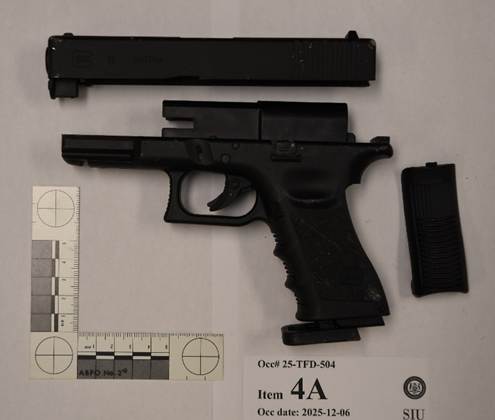 Image taken by SIU forensic services of black &ldquo;Glock&rdquo; CO2 powered BB gun located on the middle landing area of the staircase.