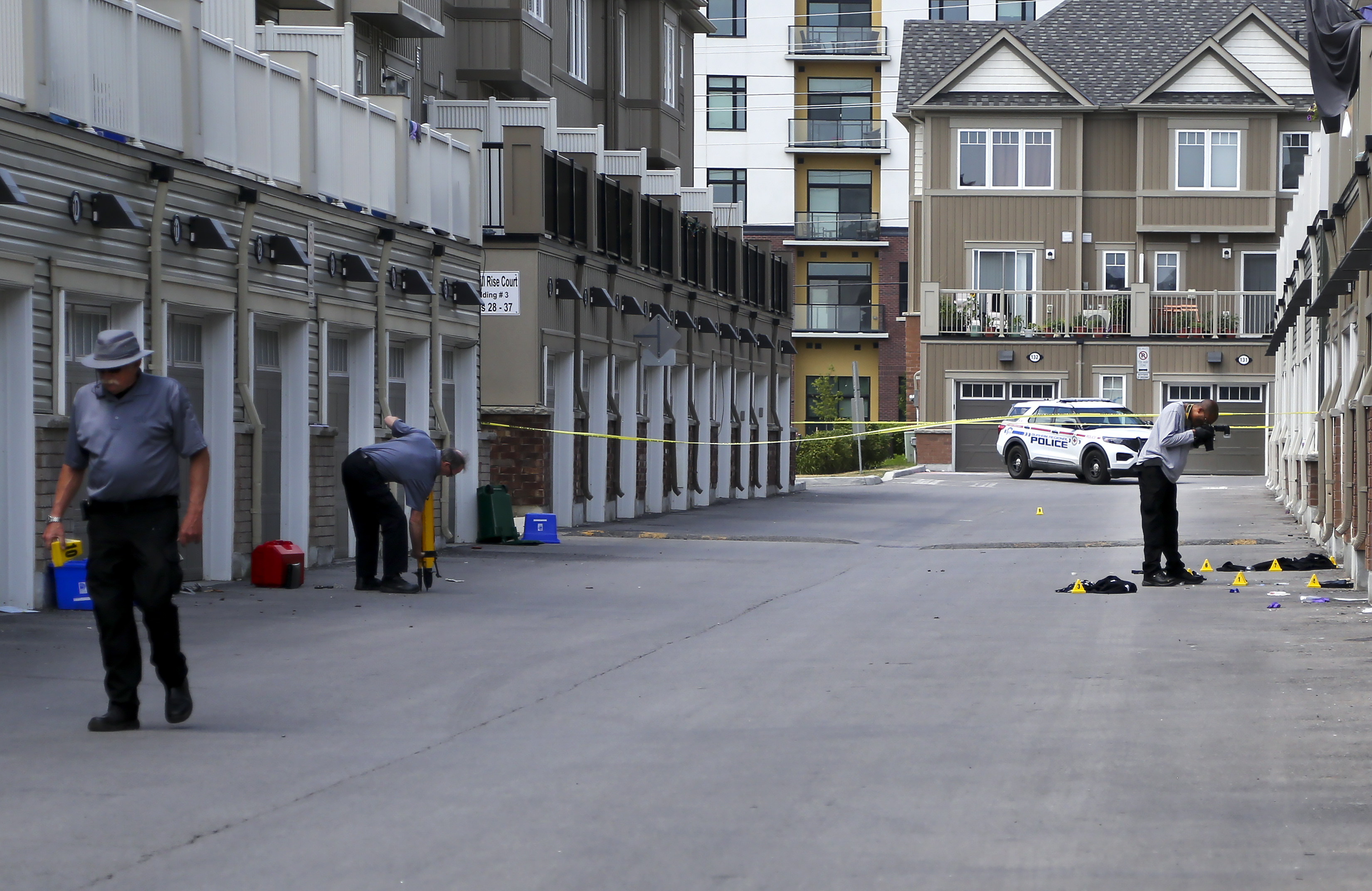 SIU forensic staff process a scene.